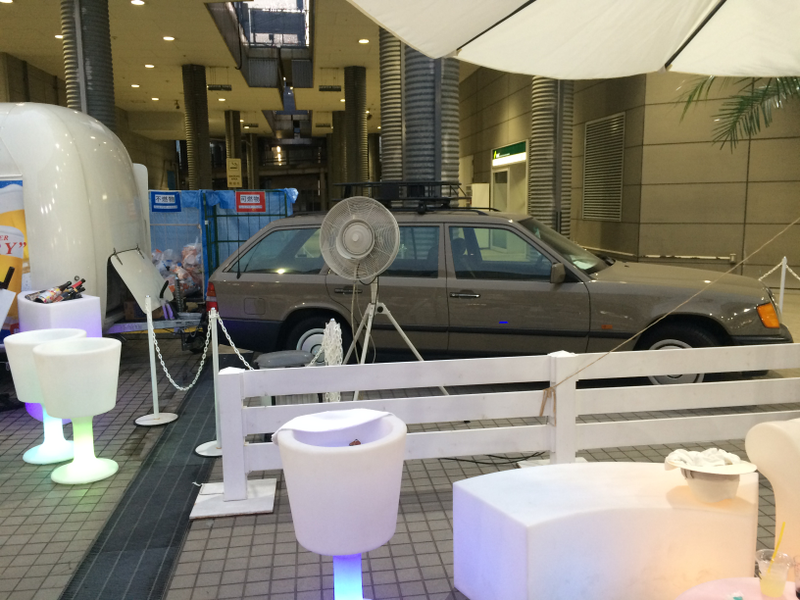 Selling beer and shaved ice out of a trailer attached to a Merc wagon.